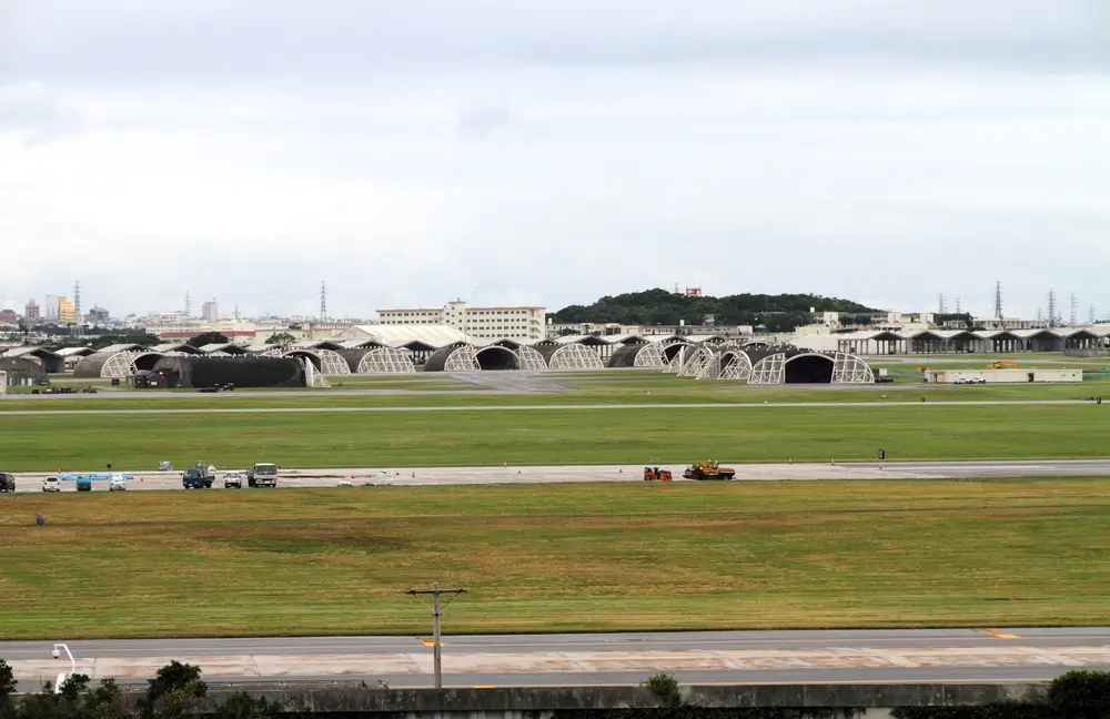 Aerial view of aircraft hangars and buildings at an NZDF military base.